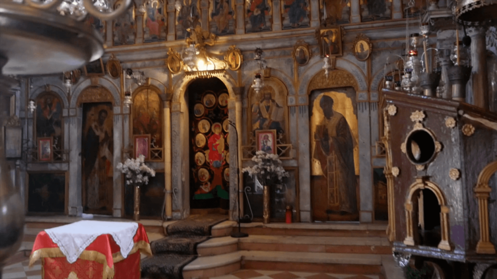 a church with a staircase and a table