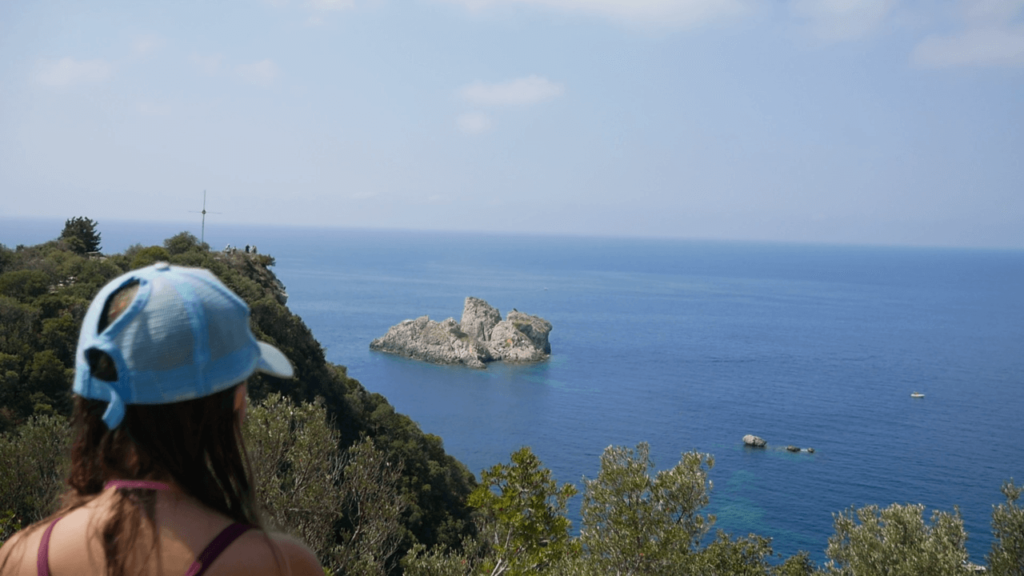 a woman looking at a body of water
